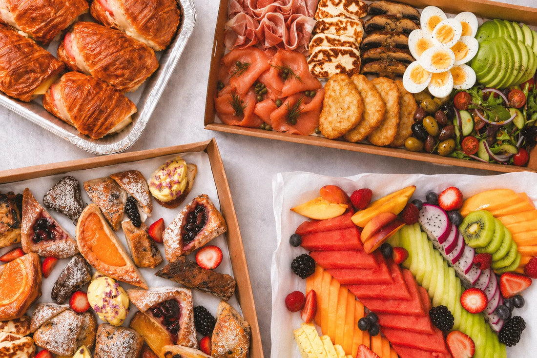 EATALO Italian merenda morning tea catering platter Sydney CBD — breakfast bruschetta with smoked salmon, prosciutto and avocado, sweets, fruit platter, croissants