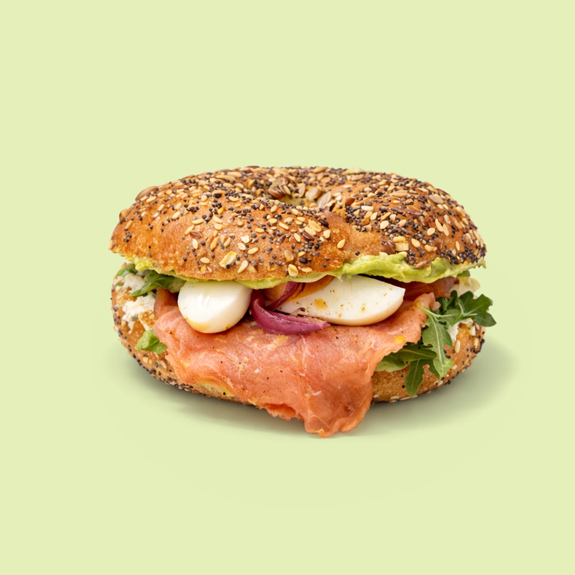 Smoked salmon bagel with herb ricotta, rocket and capers for office catering Sydney CBD