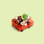 Watermelon and prosciutto canapé with fresh basil and balsamic glaze for catering Sydney CBD