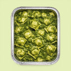 Tray of italian ravioli with pesto sauce for office catering