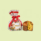 A packaged Italian panettone with a festive red and white patterned bag tied with a red ribbon, shown next to a sliced panettone loaf on a pale yellow-green background. The bag features the brand name 'Muzzi al Panettone'.