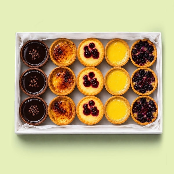 Assorted Italian mini tartlets platter with chocolate, lemon, berry, crème brûlée and frangipane tarts for office catering in Sydney CBD.