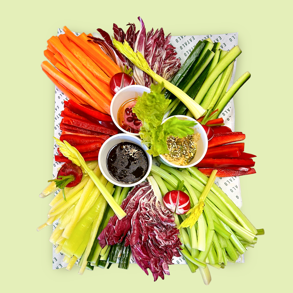 Italian vegetable crudités platter with carrots, cucumber, capsicum, fennel, radish, endive and dipping sauces.