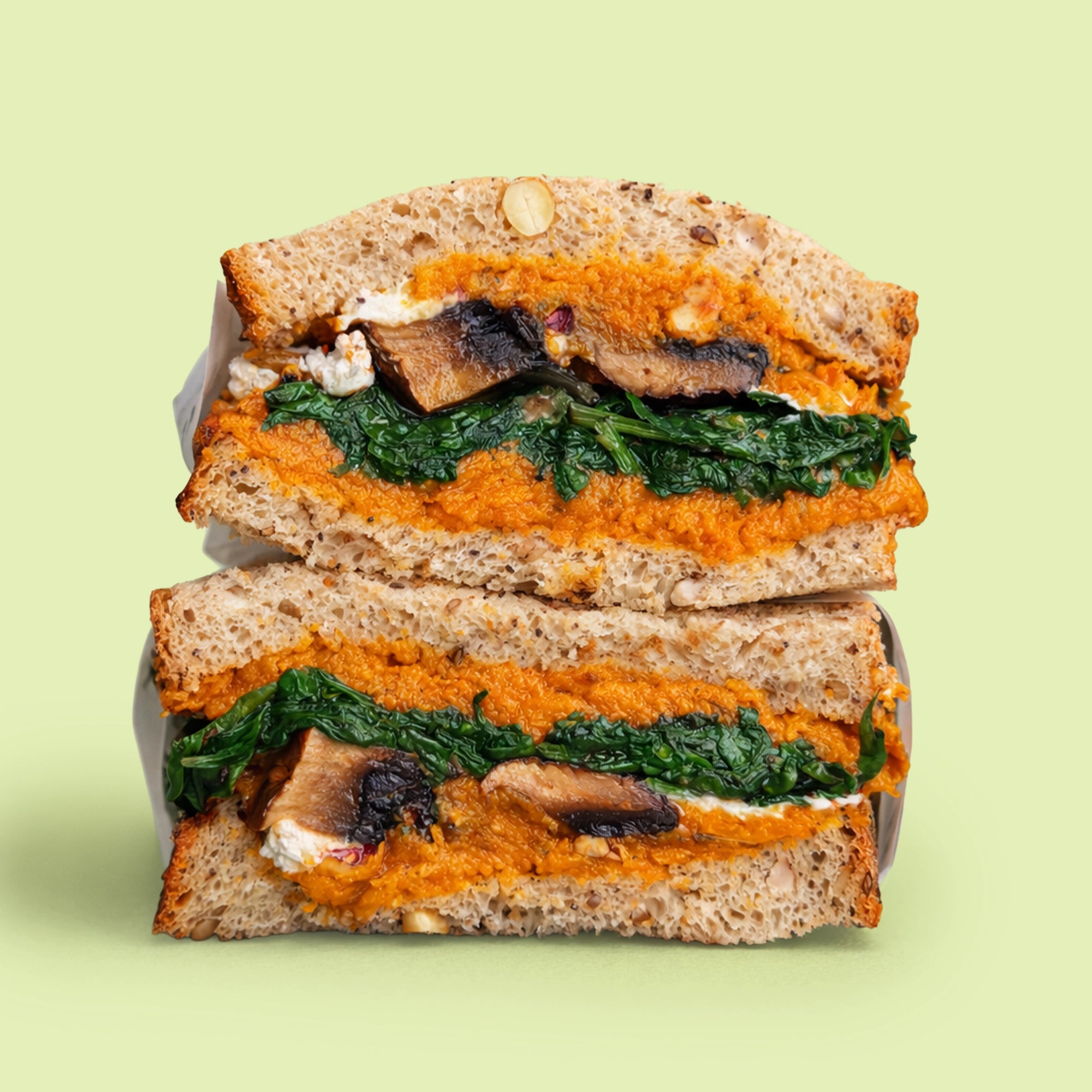 Roasted pumpkin sandwich with goat cheese and hazelnuts on sourdough for catering Sydney CBD