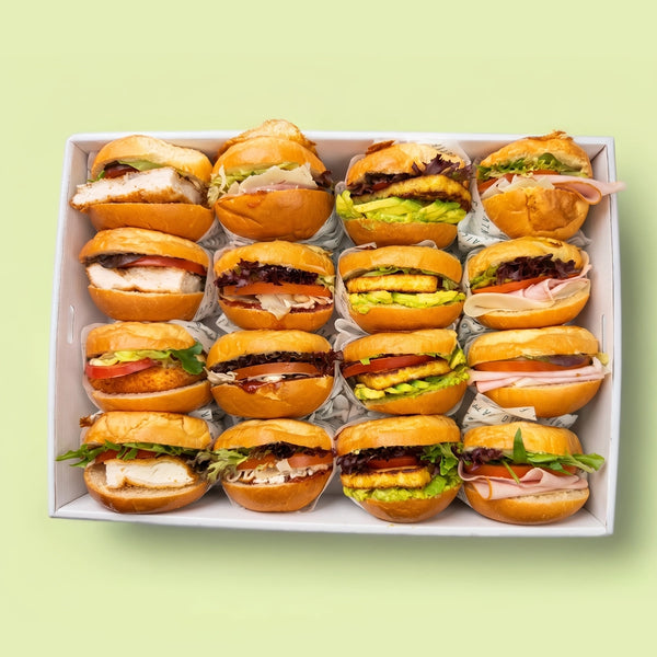 Box of 16 mini burgers with various fillings on a light green background