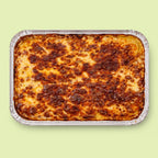 Baked Italian lasagna with pork and beef in a foil tray